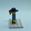 LEGO Minifigure Girl, Freckles, Dark Tan Vest Over Dark Azure Shirt, Dark Blue Cap - Image 2