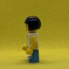 LEGO Child - Girl, White Halter Top Minifigure with Green Apples and Lime Spots, Medium Blue Short Legs, Black Bob Cut Hair, Freckles - Image 5