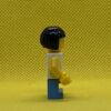 LEGO Child - Girl, White Halter Top Minifigure with Green Apples and Lime Spots, Medium Blue Short Legs, Black Bob Cut Hair, Freckles - Image 3